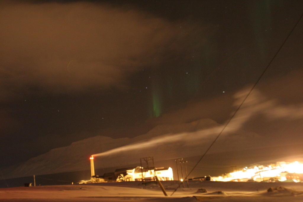Northern lights over the mountains across the water