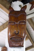 Traditional wood mask carving at Eudovic's Art Studio