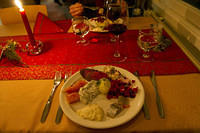 Christmas dinner appetizers: gravlax, roast reindeer, smoked reindeer on crackers, beet salad with beet cream,